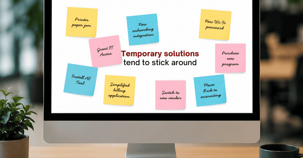 Computer monitor displaying sticky notes with common IT issues and temporary fixes, highlighting how short-term technology solutions can become permanent.