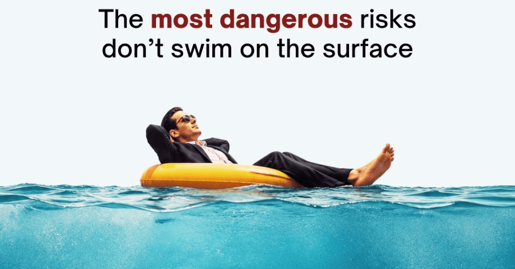Business professional relaxing on a pool float above the water, illustrating how serious cybersecurity and business risks can remain hidden beneath the surface.